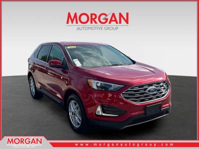 2022 Ford Edge SEL in Rapid Red Metallic Tinted Clearcoat — front three-quarter view