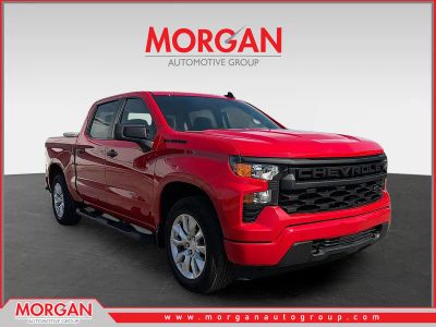 2024 Chevrolet Silverado 1500 Custom in Red Hot — front three-quarter view