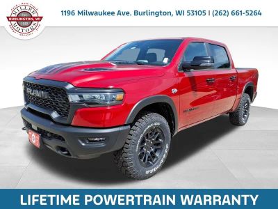 2026 RAM Ram 1500 RAM 1500 REBEL CREW CAB 4X4 5'7' BOX in Molten Red Pearl-Coat Exterior Paint — front three-quarter view