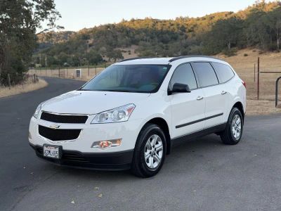 2011 Chevrolet Traverse in White — front three-quarter view