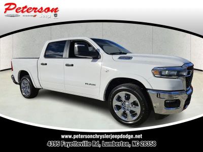 2026 RAM Ram 1500 RAM 1500 BIG HORN CREW CAB 4X4 5'7' BOX in Bright White Clear-Coat Exterior Paint — front three-quarter view