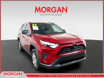 2025 Toyota RAV4 Hybrid LE in Red — front three-quarter view