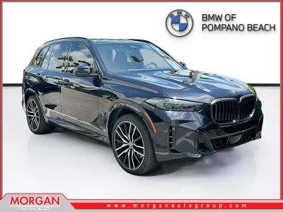 2024 BMW X5 sDrive40i in Carbon Black Metallic — front three-quarter view