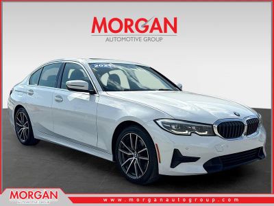 2021 BMW 3 Series 330i in Alpine White — front three-quarter view