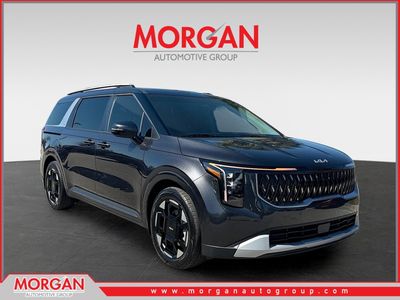2026 Kia Carnival EX in Panthera Metal — front three-quarter view