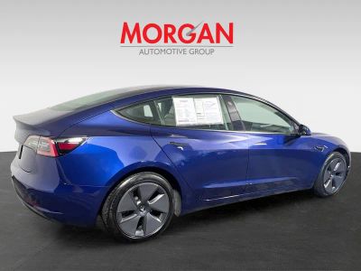 2023 Tesla Model 3 — rear three-quarter view