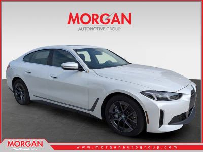 2025 BMW i4 xDrive40 in White Metallic — front three-quarter view