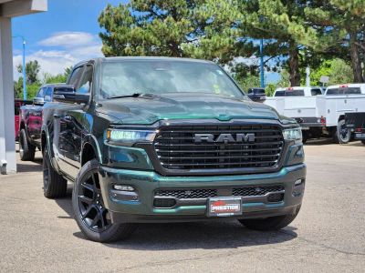 2026 RAM 1500 RAM 1500 LARAMIE CREW CAB 4X4 5'7' BOX in Serrano-Green Metallic Exterior Paint — front three-quarter view