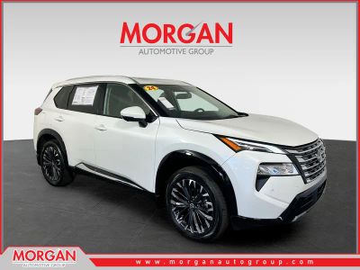 2024 Nissan Rogue Platinum in White Pearl — front three-quarter view
