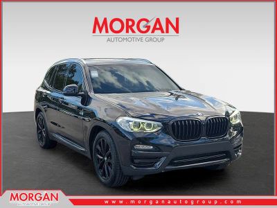 2019 BMW X3 sDrive30i in Jet Black — front three-quarter view