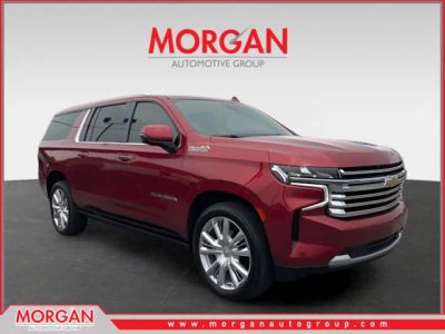 2021 Chevrolet Suburban High Country in Red — front three-quarter view