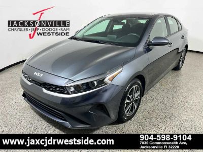 2024 Kia Forte LXS in Gravity Gray — front three-quarter view