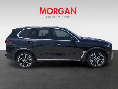 2026 BMW X5 — rear three-quarter view