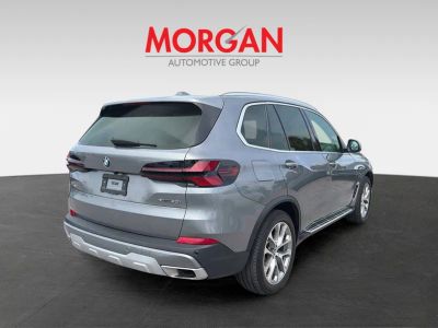 2025 BMW X5 — rear three-quarter view
