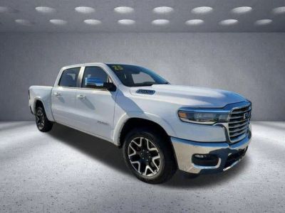 2025 RAM 1500 Laramie in White — front three-quarter view