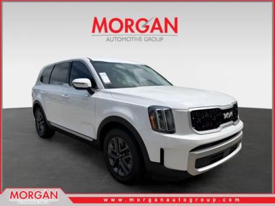 2024 Kia Telluride LX in White — front three-quarter view