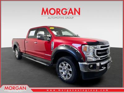 2021 Ford F-250SD Lariat in Rapid Red Metallic Tinted Clearcoat — front three-quarter view