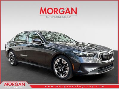 2026 BMW 5 Series 530i in Dark Graphite Metallic — front three-quarter view