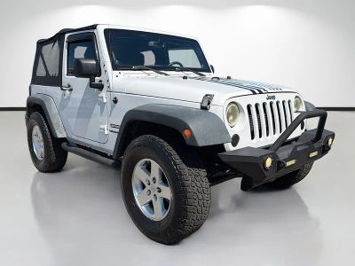 2014 Jeep Wrangler Sport in White — front three-quarter view