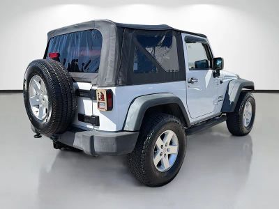 2014 Jeep Wrangler — rear three-quarter view
