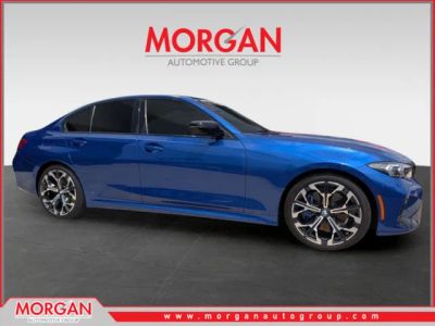 2025 BMW 3 Series 330i in Portimao Blue Metallic — front three-quarter view