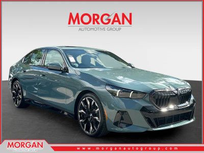 2026 BMW 5 Series 530i in Cape York Green Metallic — front three-quarter view