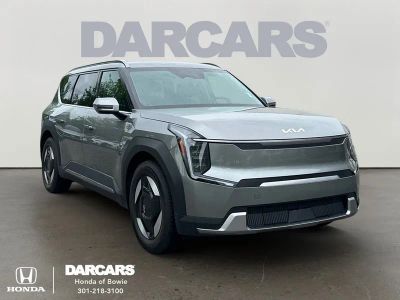 2024 Kia EV9 Wind in Pebble Gray — front three-quarter view