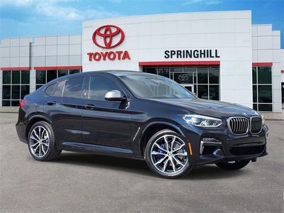 2021 BMW X4 M40i — front three-quarter view