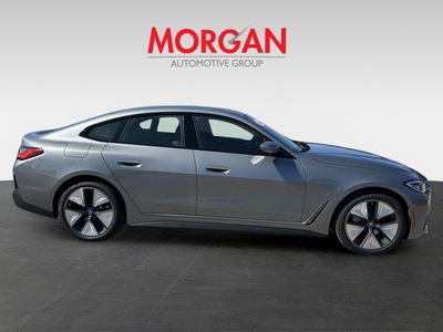 2023 BMW i4 — rear three-quarter view