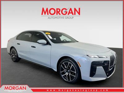 2024 BMW 7 Series 740i in Brooklyn Gray Metallic — front three-quarter view