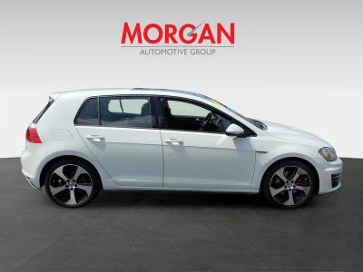 2015 Volkswagen Golf GTI — rear three-quarter view