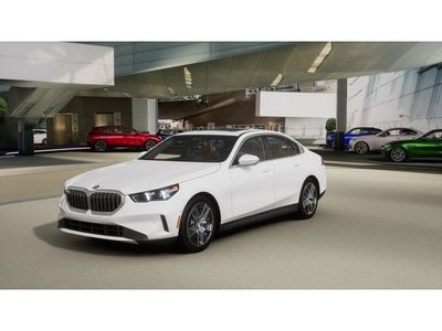 2026 BMW 5 Series 530i xDrive in Alpine White — front three-quarter view