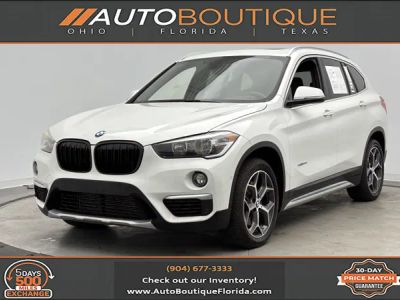 2018 BMW X1 xDrive28i in Alpine White — front three-quarter view