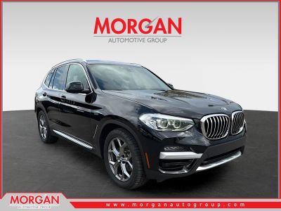 2020 BMW X3 sDrive30i in Jet Black — front three-quarter view