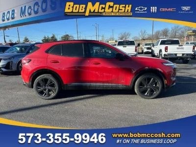2025 Buick Envision Sport Touring in Brilliant Red — front three-quarter view