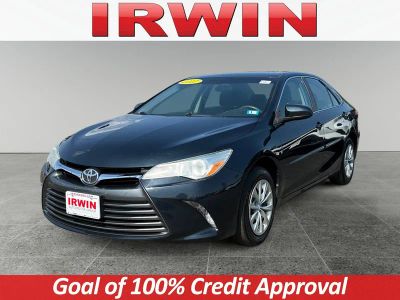 2017 Toyota Camry LE in Black — front three-quarter view