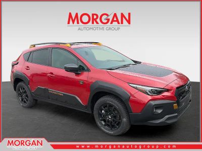 2026 Subaru Crosstrek Wilderness in Lithium Red Pearl — front three-quarter view