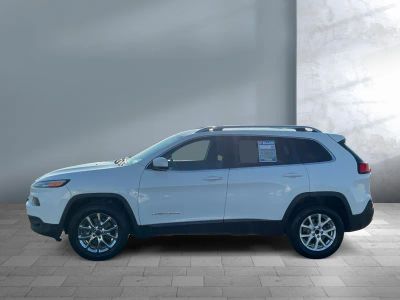 2015 Jeep Cherokee — rear three-quarter view