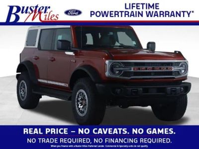 2026 Ford Bronco Outer Banks in Ruby Red Metallic Tinted Clearcoat — front three-quarter view