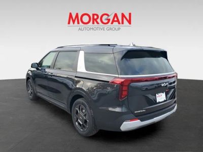 2026 Kia Carnival Hybrid — rear three-quarter view