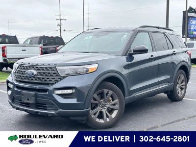 2023 Ford Explorer XLT in Stone Blue — front three-quarter view