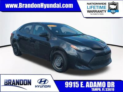 2018 Toyota Corolla LE in Black — front three-quarter view