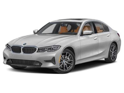 2022 BMW 3 Series 330i in Phytonic Blue Metallic — front three-quarter view
