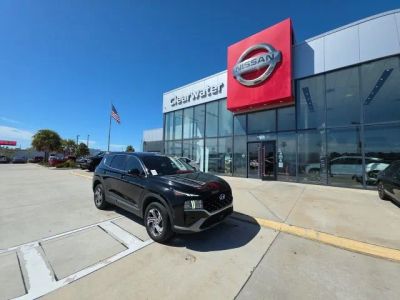 2023 Hyundai Santa Fe SE in Black — front three-quarter view