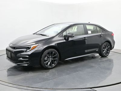 2026 Toyota Corolla Hybrid SE AWD in Midnight Black Metallic — front three-quarter view