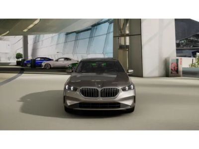2027 BMW 5 Series — rear three-quarter view