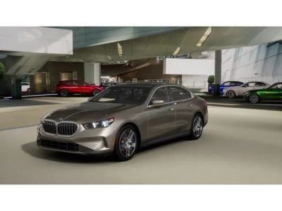 2027 BMW 5 Series 530i xDrive in Oxide Grey Metallic — front three-quarter view