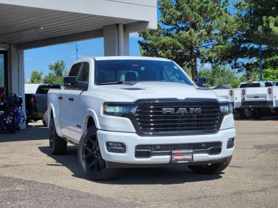 2026 RAM 1500 RAM 1500 LARAMIE CREW CAB 4X4 5'7' BOX in Bright White Clear-Coat Exterior Paint — front three-quarter view