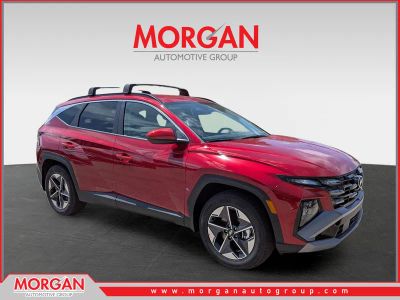 2026 Hyundai TUCSON SEL in Ultimate Red — front three-quarter view