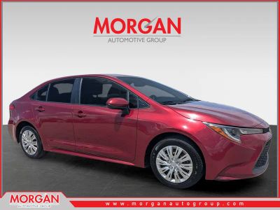 2022 Toyota Corolla LE in Ruby Flare Pearl — front three-quarter view
